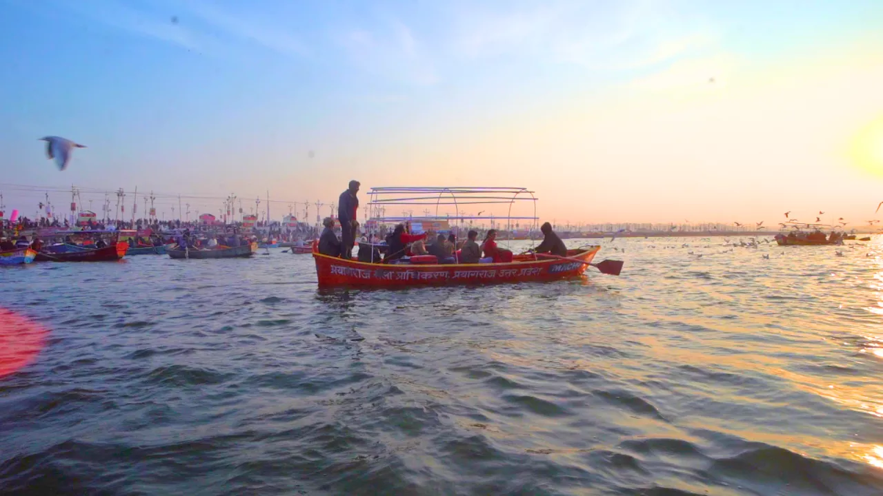 Wooden boats carrying pilgrims at the Triveni Sangam during the Magh Mela