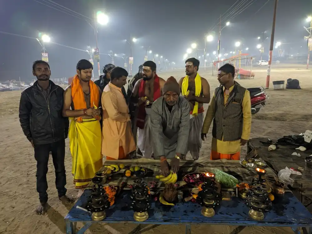 A Prayag Pandits pandit performing Ganga poojan at the Triveni Sangam